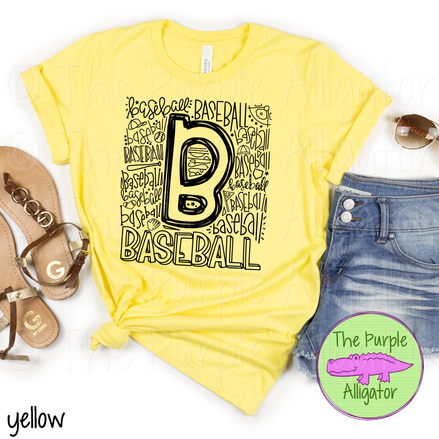 A yellow t-shirt with text 'Baseball' printed in a stylized font, accompanied by a pair of blue denim shorts and a pair of sandals, with a purple alligator logo in the corner.